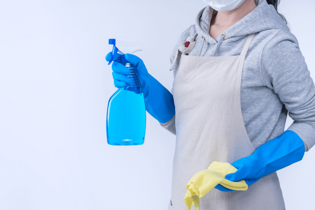 Woman with cleaning supplies