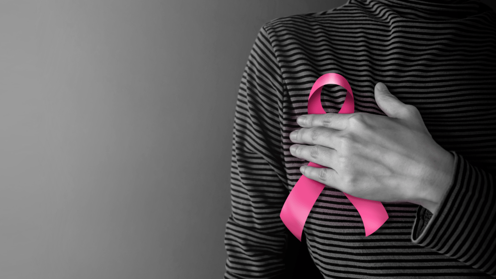 Women with pink ribbon for breast cancer awareness